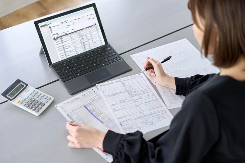 Heather Harmon, professional bookkeeper reviewing client financials